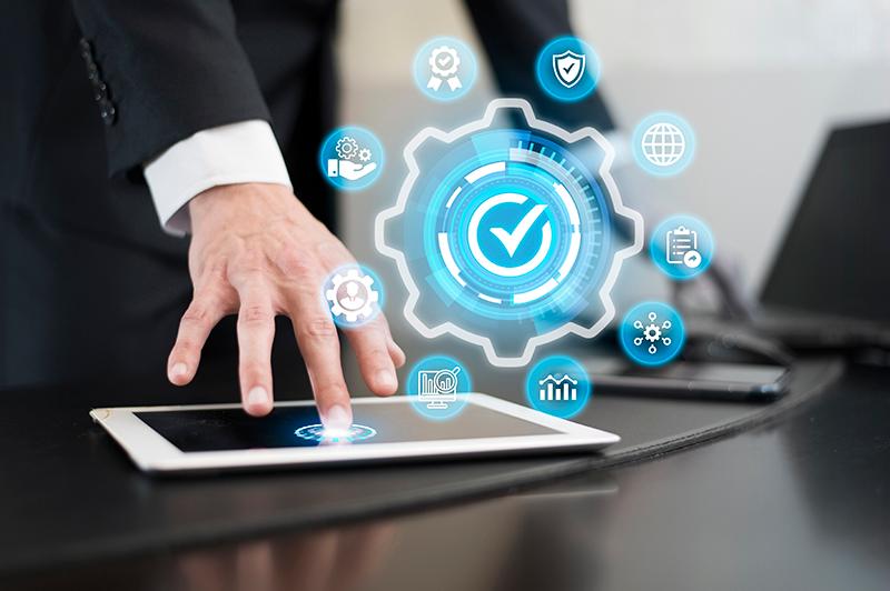 Business professional using tablet to manage digital compliance and performance.